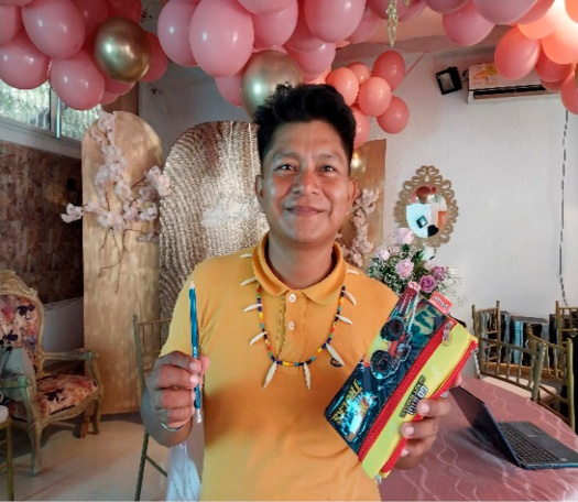 A person holding a box and a brush
AI-generated content may be incorrect.